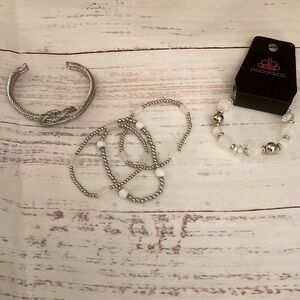 Stack of White and Silver Bracelets